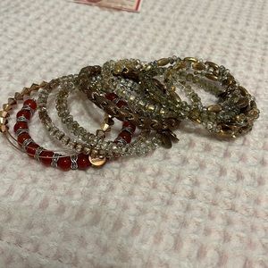 Stack of 9 Alex & Ani bracelets